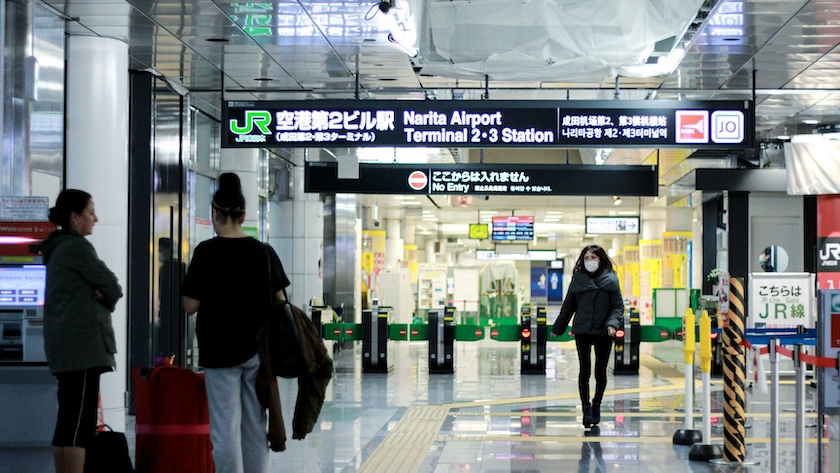 Travelers arriving at Japan's Narita Airport.