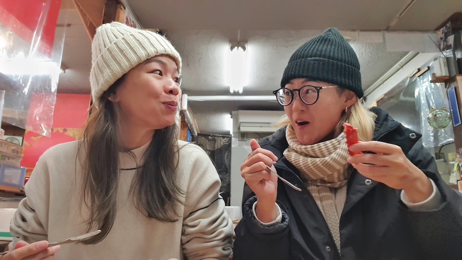 Young couple enjoying food in Japan.