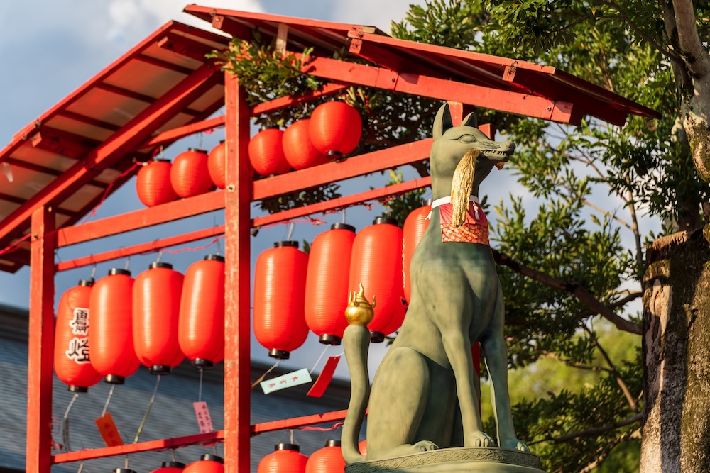 An Inari statue at Motomiya Festival, Fushima Inari Taisha shrine in Kyoto. An Inari statue at Motomiya Festival, Fushima Inari Taisha shrine in Kyoto.