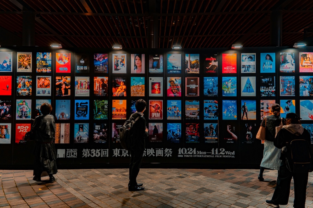 Movie lovers gaze at film posters at the Tokyo International Film Festival. Movie lovers gaze at film posters at the Tokyo International Film Festival.